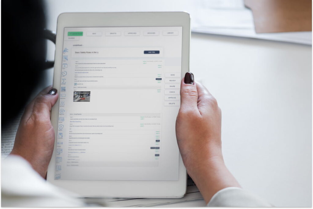 A women holding a tablet with a Laboratory Information Management System (LIMS) loaded on the screen